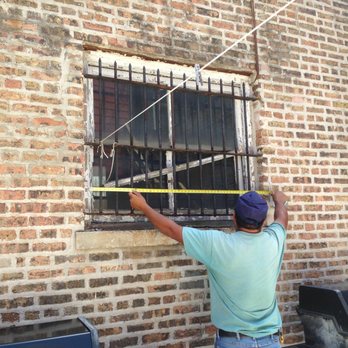 Rico's Masonry - Measuring for new glass block windows. - Masonry/Concrete Near Me - Chicago, Illinois