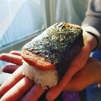 Crazy Curry - a hand holding a piece of sushi - Japanese Curry Near Me - Belmont, California Crazy Curry - a hand holding a piece of sushi - Japanese Curry Near Me - Belmont, California