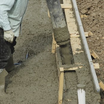 Rojas Landscaping - a man using a trowe to level a concrete slab - General Contractors Near Me Rojas Landscaping - a man using a trowe to level a concrete slab - General Contractors Near Me