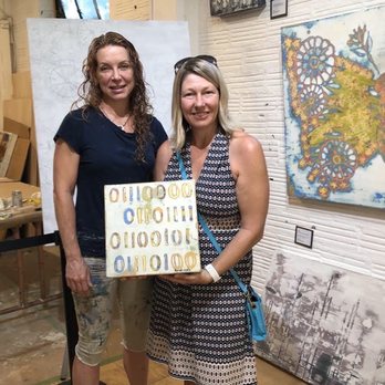 Phil Mechanic Studios - Happy client with a binary painting that says "Poet"  by L Rowland Fine Contemporary Art - Art Galleries Near Me - Asheville, North Carolina
