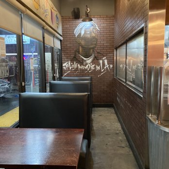 Dirt Dog - Seating with mural of Tupac - Hot Dogs Near Me - Los Angeles, California Dirt Dog - Seating with mural of Tupac - Hot Dogs Near Me - Los Angeles, California