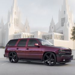 Ronnie's Electronics - Chevy Tahoe lowered and sitting nicely on 26" dub ballers also finished in a custom gloss black