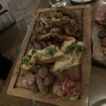 The Crunkleton - WGF for the table! Lamb, Duck Confit, Sausages with Lusty Monk Mustard, Pickled Vegetables, Mushroom Demi, Chimichurri, Hearth Bread - Cocktail Bars Near Me - Charlotte, North Carolina The Crunkleton - WGF for the table! Lamb, Duck Confit, Sausages with Lusty Monk Mustard, Pickled Vegetables, Mushroom Demi, Chimichurri, Hearth Bread - Cocktail Bars Near Me - Charlotte, North Carolina
