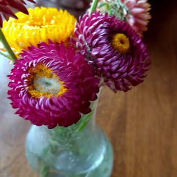 The Friendly Fox - Fresh flowers at the tables at the Friendly Fox. - Cafes Near Me - Fort Wayne, Indiana