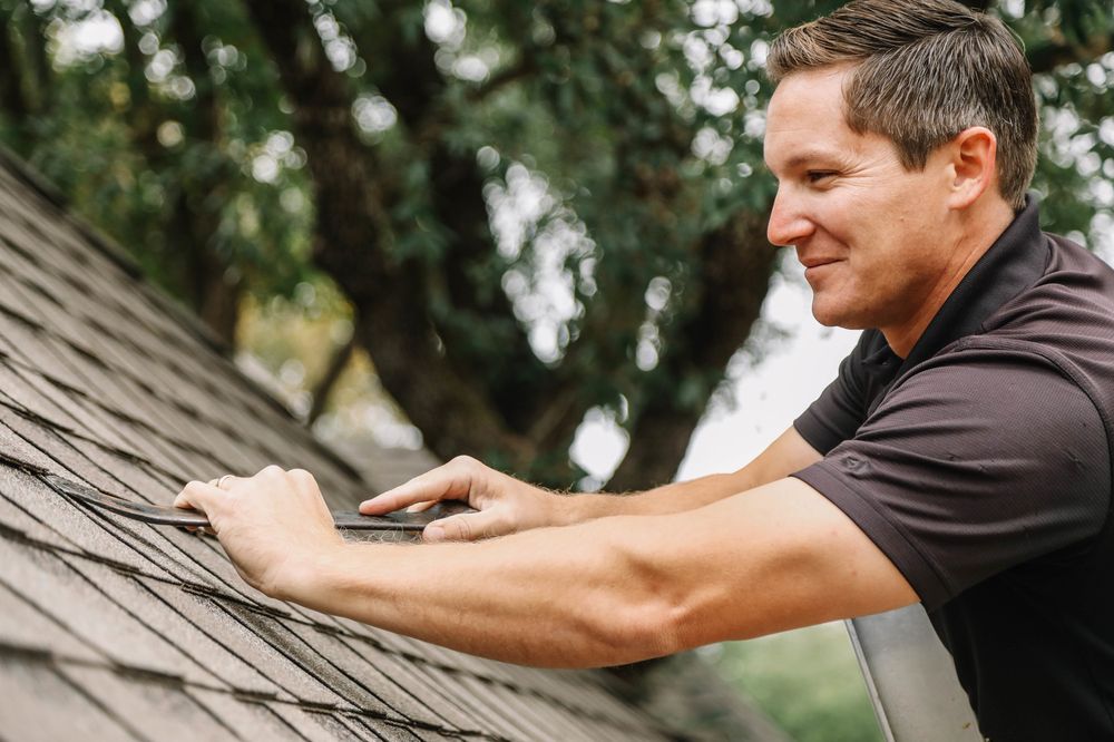 Slide of Yuras Roofing