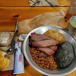Fort Hays & Mount Rushmore Tours - The meal including brisket, baked beans, hot potato, biscuit and applesauce