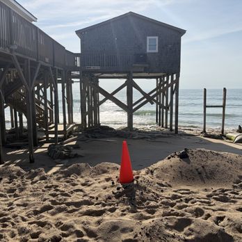 Outer Banks Motel - The steps and balcony used to be there. You can also see the parking area is a wash out with a cone to keep patrons out of it - Hotels Near Me - Buxton, North Carolina Outer Banks Motel - The steps and balcony used to be there. You can also see the parking area is a wash out with a cone to keep patrons out of it - Hotels Near Me - Buxton, North Carolina