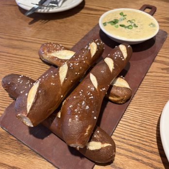 Old Chicago Pizza + Taproom - Bavarian Pretzel Sticks with mustard beer cheese sauce made with Guinness - Pizza Near Me - Manhattan, Kansas