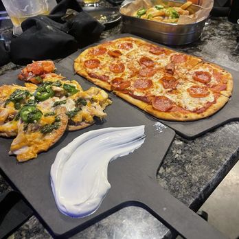 Topgolf - Pizza, fries with cheese and jalapeños, chicken nachos. - Golf Near Me - Roseville, California Topgolf - Pizza, fries with cheese and jalapeños, chicken nachos. - Golf Near Me - Roseville, California
