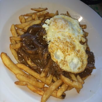 Papermoon Diner - The "Hangover" : fried eggs with a runny center and mushroom gravy over fries. The perfect, savory hangover food! - Diners Near Me - Baltimore, Maryland