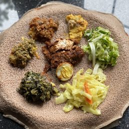 Veggie sampler, doro wat (there was wayyy more food this is just my portion). Veggie sampler, doro wat (there was wayyy more food this is just my portion).