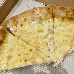 Mezzaluna Pizzeria At Halifax - What's left, for now, of our white pizza with garlic added