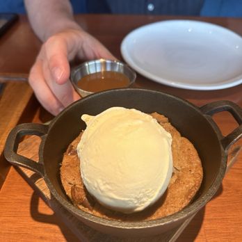 Ossobuco Miami- Steak house - Skillet chocolate chip cookie with ice cream and salted caramel sauce - Steakhouses Near Me - Miami, Florida Ossobuco Miami- Steak house - Skillet chocolate chip cookie with ice cream and salted caramel sauce - Steakhouses Near Me - Miami, Florida