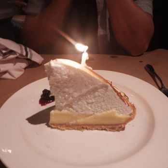 Celadon - Lemon cake with birthday candle - Seafood Near Me - Napa, California