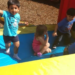 Our students enjoying a summer afternoon moon bounce!