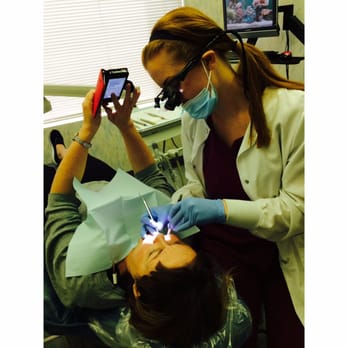 Dean L Brown, DDS: Dean Brown, DDS - Here is a picture of the hygienist cleaning Dr. Brown's wife's teeth (while she texts)! - General Dentistry Near Me - Woodland Hills, California Dean L Brown, DDS: Dean Brown, DDS - Here is a picture of the hygienist cleaning Dr. Brown's wife's teeth (while she texts)! - General Dentistry Near Me - Woodland Hills, California