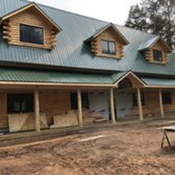 Gurden Construction - a log house with a green roof - General Contractors Near Me - Cadillac, Michigan Gurden Construction - a log house with a green roof - General Contractors Near Me - Cadillac, Michigan