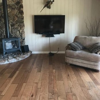 Western Flooring - a living room with a wood burning stove - Flooring Near Me - Santee, California