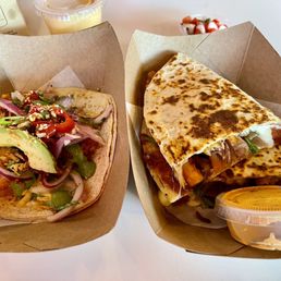 Crunchy Shrimp Hidden Drewno soft taco (left), Traditional Chicken Quesadilla (right) Crunchy Shrimp Hidden Drewno soft taco (left), Traditional Chicken Quesadilla (right)