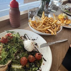 Cafe Neo - Avocado toast, fries, chili eggs, mushroom flatbread, and bagel