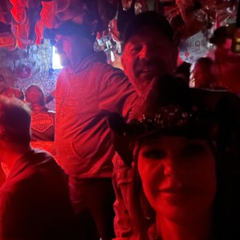 Dungeon Bar - a group of people in a dimly lit bar - Bars Near Me - Sturgis, South Dakota