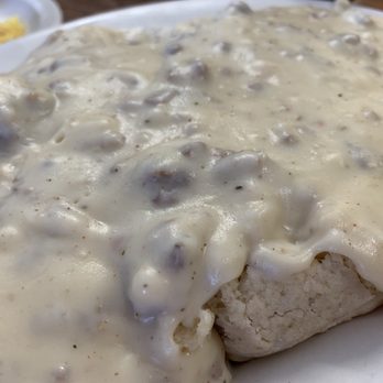 SmokeHouse - a plate of biscuits covered in gravy - Smokehouse Near Me - Punta Gorda, Florida