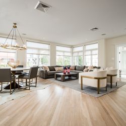 Perianth Interior Design - Far Rockaway Beach House combined expansive Living area and Dining Room feels  relaxing and formal with contrasting furniture shapes