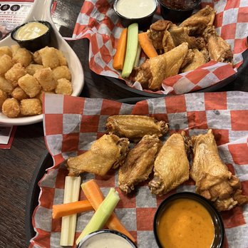 Roots Burger Bar - BOGO free wings Mondays. Two 1/2 pound orders of bone-in wings with sauce on the side. 10 wings for $10.99 Plus and order of tots for $2.25 - American Near Me - Carmel, Indiana Roots Burger Bar - BOGO free wings Mondays. Two 1/2 pound orders of bone-in wings with sauce on the side. 10 wings for $10.99 Plus and order of tots for $2.25 - American Near Me - Carmel, Indiana