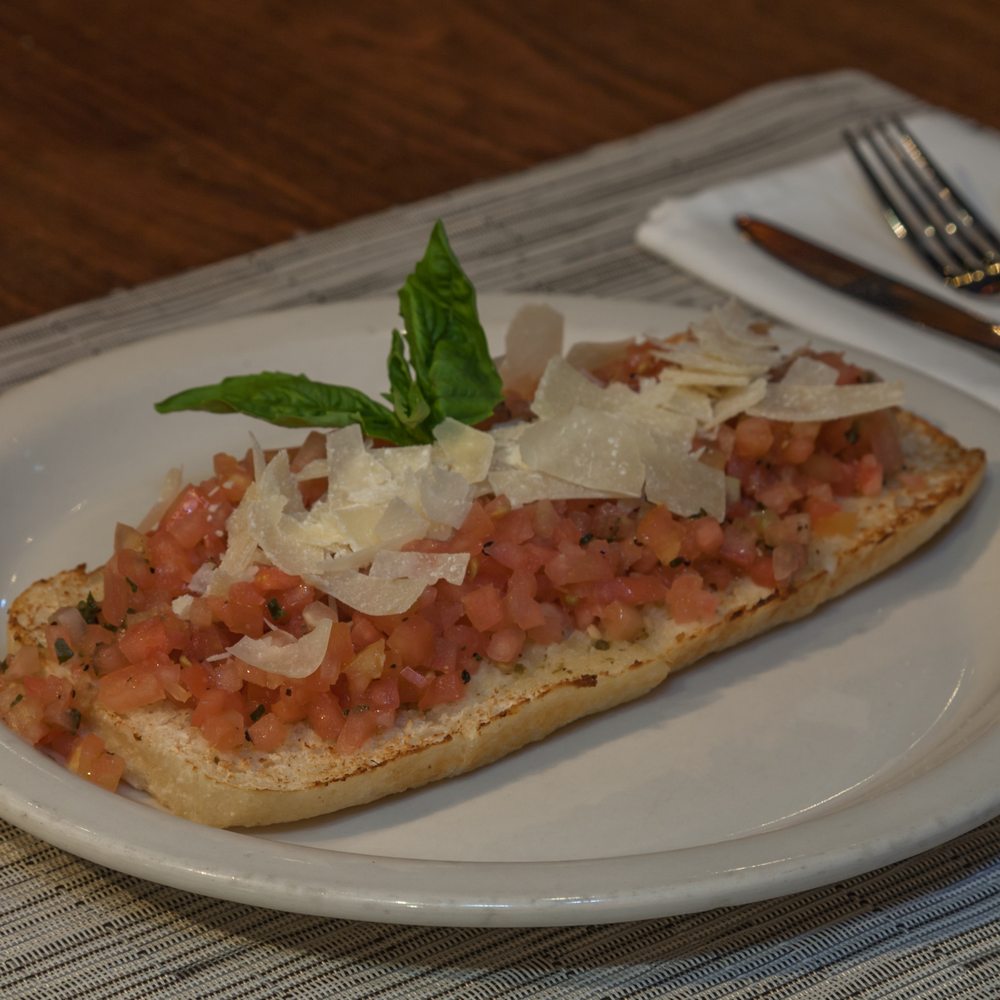 Italian Pizza Kitchen - a slice of bread topped with tomatoes and cheese - Italian Near Me - Washington, DC, District of Columbia Italian Pizza Kitchen - a slice of bread topped with tomatoes and cheese - Italian Near Me - Washington, DC, District of Columbia