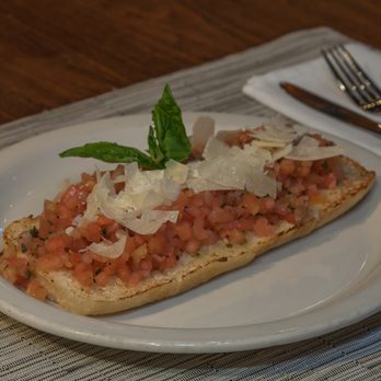 Italian Pizza Kitchen - a slice of bread topped with tomatoes and cheese - Italian Near Me - Washington, DC, District of Columbia