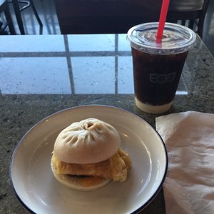 Photo of Orient Espresso - Denver, CO, United States. Breakfast bao and iced Vietnamese coffee.