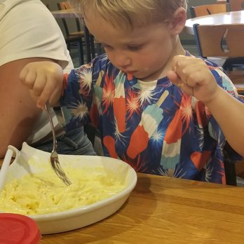 Barker's Island Boathouse Restaurant - a young boy eating pasta - Seafood Near Me - Superior, Wisconsin Barker's Island Boathouse Restaurant - a young boy eating pasta - Seafood Near Me - Superior, Wisconsin