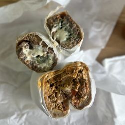 La Azteca Tortillera - Cut in half Chile Relleno w/ asada & Ranchero Bfast burritos