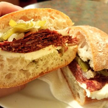 Salumi - Mole sandwich on Giuseppe bread with onion and pepper and fresh mozzarella. - Italian Near Me - Seattle, Washington Salumi - Mole sandwich on Giuseppe bread with onion and pepper and fresh mozzarella. - Italian Near Me - Seattle, Washington