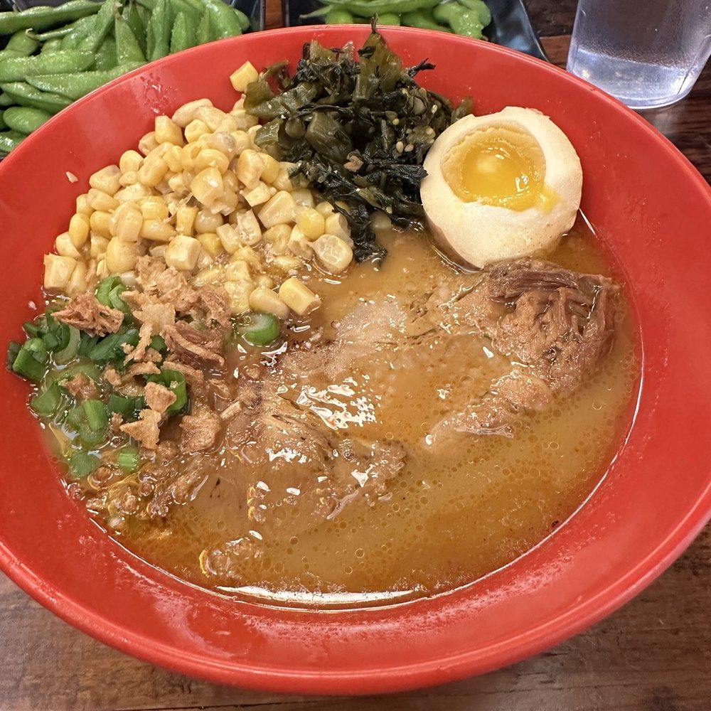 Nomiya - Half spicy ramen with corn and pickled greens added - Ramen Near Me - New Orleans, Louisiana Nomiya - Half spicy ramen with corn and pickled greens added - Ramen Near Me - New Orleans, Louisiana