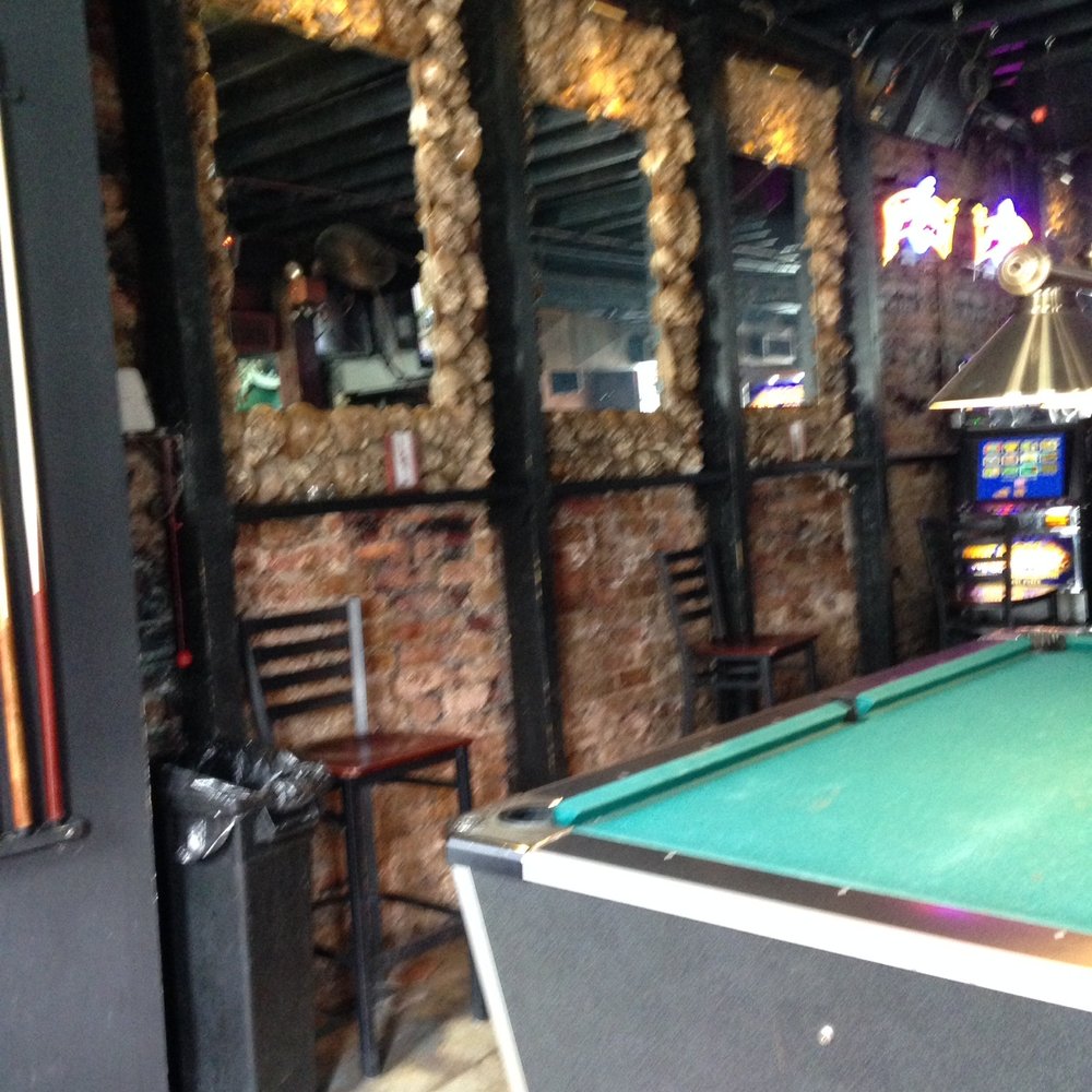 Toulouse Dive Bar - Skull mirror wall next to the pool table and slot machines. - Dive Bars Near Me - New Orleans, Louisiana Toulouse Dive Bar - Skull mirror wall next to the pool table and slot machines. - Dive Bars Near Me - New Orleans, Louisiana