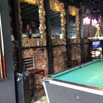 Toulouse Dive Bar - Skull mirror wall next to the pool table and slot machines. - Dive Bars Near Me - New Orleans, Louisiana