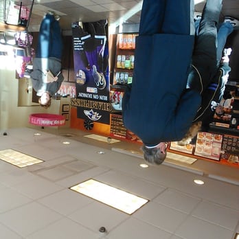 Dunkin' -  a man upside down in a store - Donuts Near Me - Baltimore, Maryland