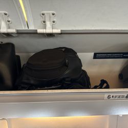 AeroMexico - Plenty of space but made us check our bag with medications.  We were #2 boarding and first row after first class.
