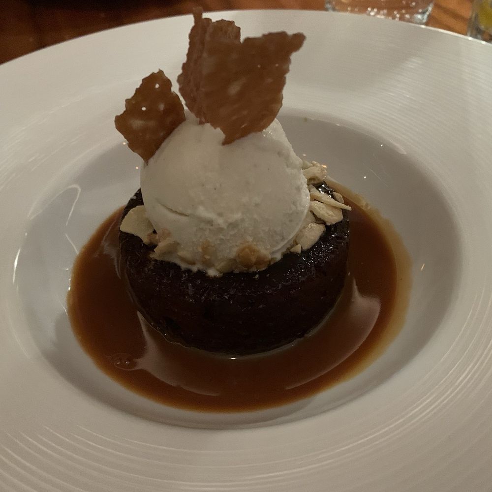 REIGN Restaurant - Sticky toffee pudding with whiskey sauce - Cocktail Bars Near Me - Toronto, Ontario REIGN Restaurant - Sticky toffee pudding with whiskey sauce - Cocktail Bars Near Me - Toronto, Ontario
