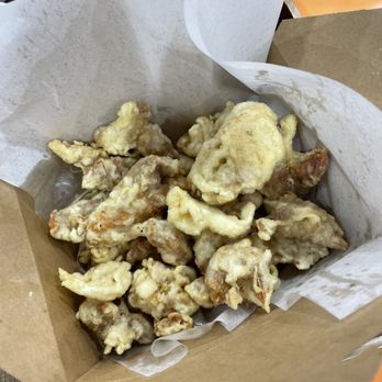Red Wok - a paper bag filled with fried food - Seafood Near Me - Niles, Illinois