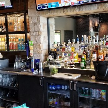 Chili's - a bar with many bottles of alcohol - Bars Near Me - Covington, Georgia