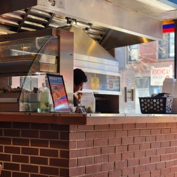Brasa Roja - a woman ordering food at a restaurant - Latin American Near Me - Chicago, Illinois Brasa Roja - a woman ordering food at a restaurant - Latin American Near Me - Chicago, Illinois