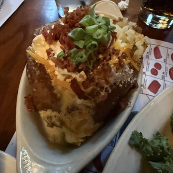 Texas Cattle Company - Loaded baked potato - Steakhouses Near Me - Lakeland, Florida Texas Cattle Company - Loaded baked potato - Steakhouses Near Me - Lakeland, Florida