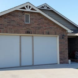 All Area Overhead - Garage Door Services - 16x7 Lifestyle Garage door Screen with sandstone color frame and white privacy screen.