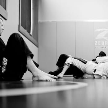 Straight Blast Gym - Coach Pritt Michelson looks on as black belts', Travis Davison & Jake Oyler roll. - Martial Arts Near Me - Kalispell, Montana Straight Blast Gym - Coach Pritt Michelson looks on as black belts', Travis Davison & Jake Oyler roll. - Martial Arts Near Me - Kalispell, Montana