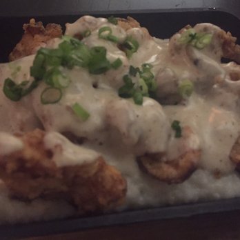 Henley - Chicken fried chanterelles with gravy and grits - New American Near Me - Nashville, Tennessee