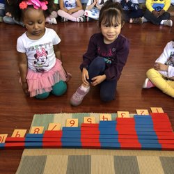 A Little World Montessori Academy - Working with number rods.