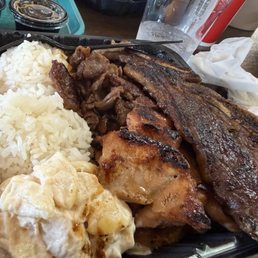 Hawaiian BBQ plate includes bbq chicken, teriyaki beef and beef rib with two rice one Mac