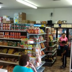 Grocery area. Fridges with cheese and freezers.with frozen fruit and pulp also.